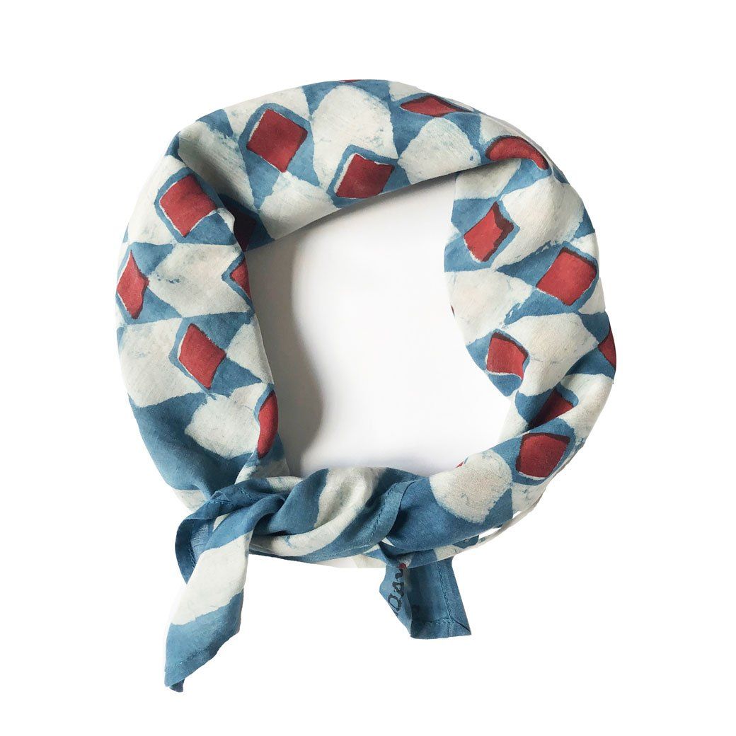 Modern Indian twist on a classic French bandana. Hand block printed with mud resist and hand dyed with natural indigo. Printed on a super soft cotton silk blend.